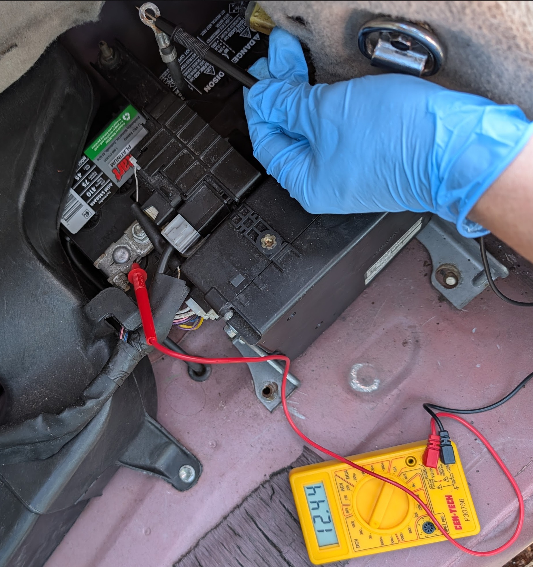Multimeter reading 12.4V on new 12V battery before connecting negative terminal